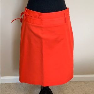 Women’s size 12 orange pencil skirt.